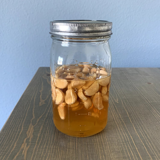 Our fermented honey and garlic in a mason jar.