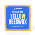 Block of 100% pure yellow beeswax with Sperry Honey branding on a blue label.