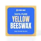 Block of 100% pure yellow beeswax with Sperry Honey branding on a blue label.