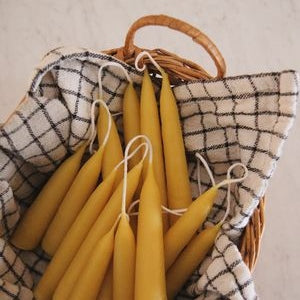 Beeswax candles in a basket