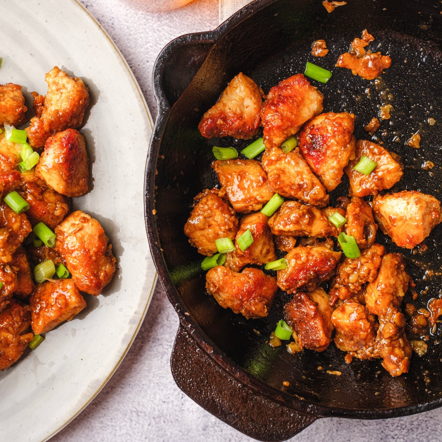 Honey chicken on a skillet and on a white plate.