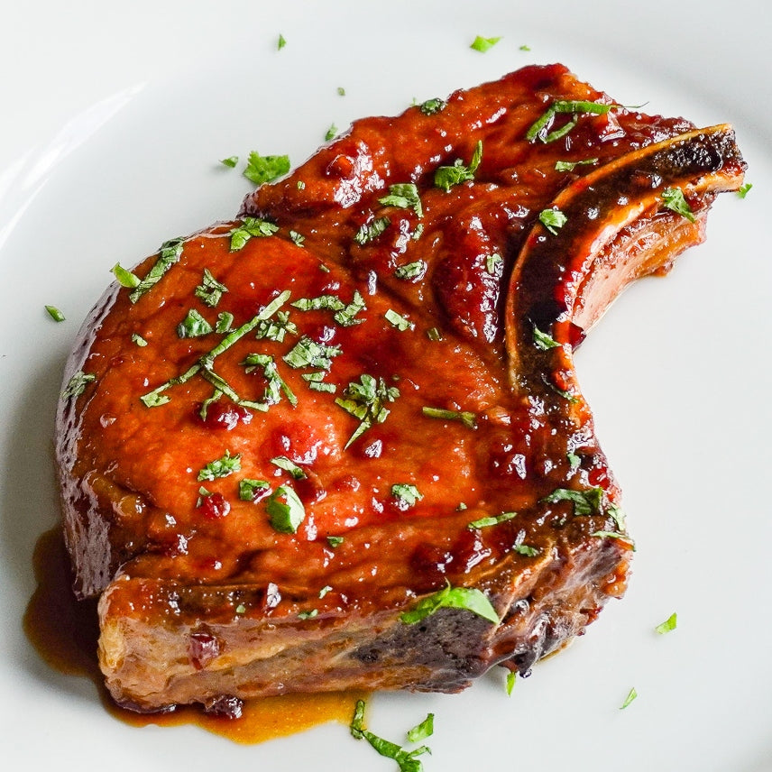 Honey garlic pork chops on a plate.