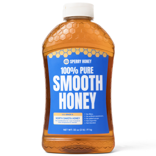 Bottle of Sperry Honey with blue label on a white background