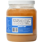 Back of a jar of 5 lb raw and unfiltered honey on a white background