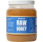Jar of 5 lb raw and unfiltered honey on a white background