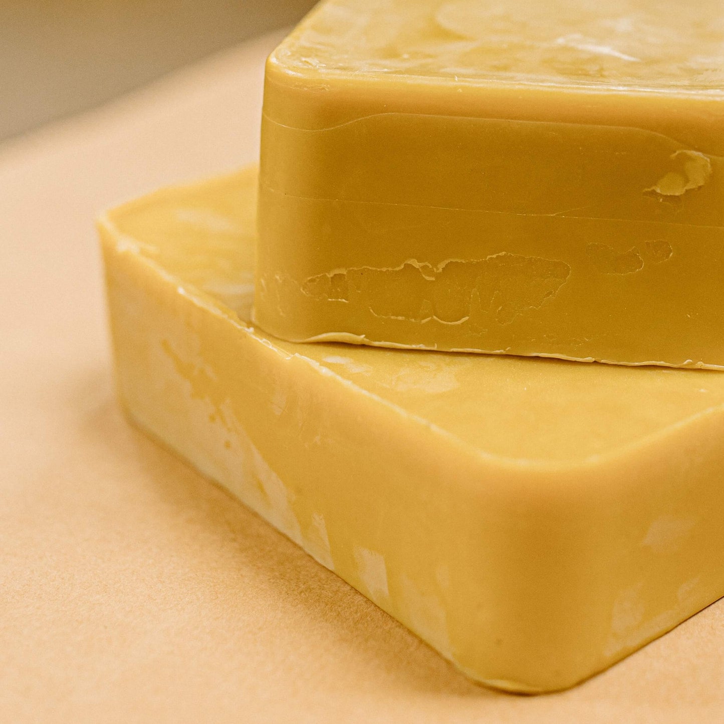 An example of an order of bulk yellow beeswax, with two blocks stacked on top of each other.